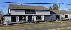 The former Colts Neck Inn, now a steakhouse, along road.